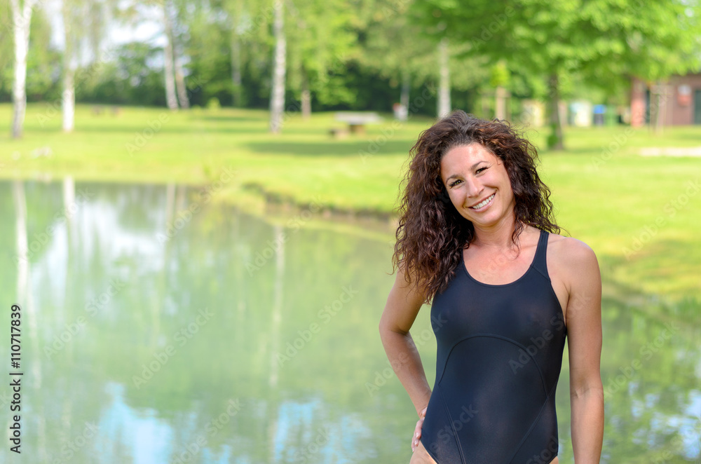 Smiling fit young woman in a bathing costume Smiling fit young woman in a bathing costume