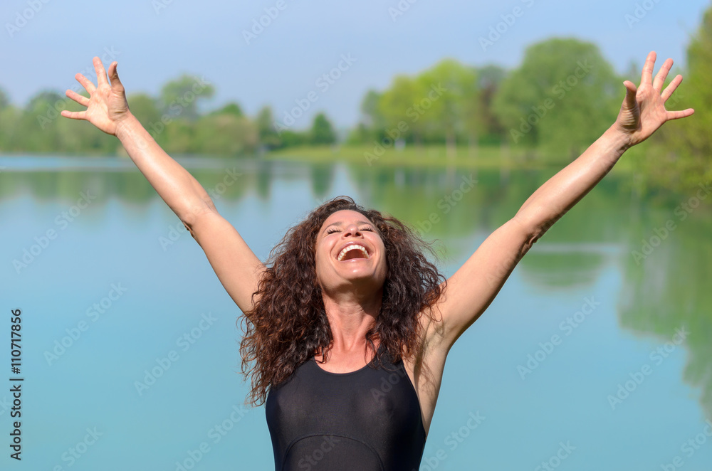 Pretty young woman rejoicing in spring sunshine Pretty young woman rejoicing in spring sunshine