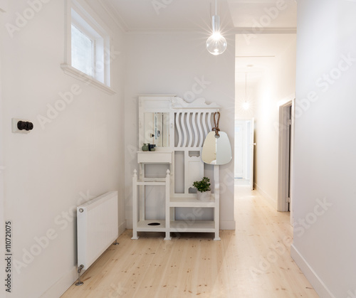 Large spacious entry foyer in beach style decorated apartment