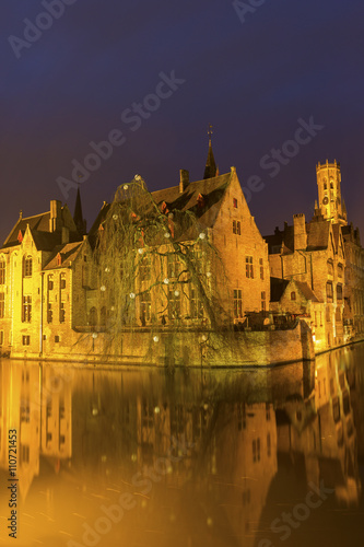 A canal in Bruges with the famous Belfry in Belgium