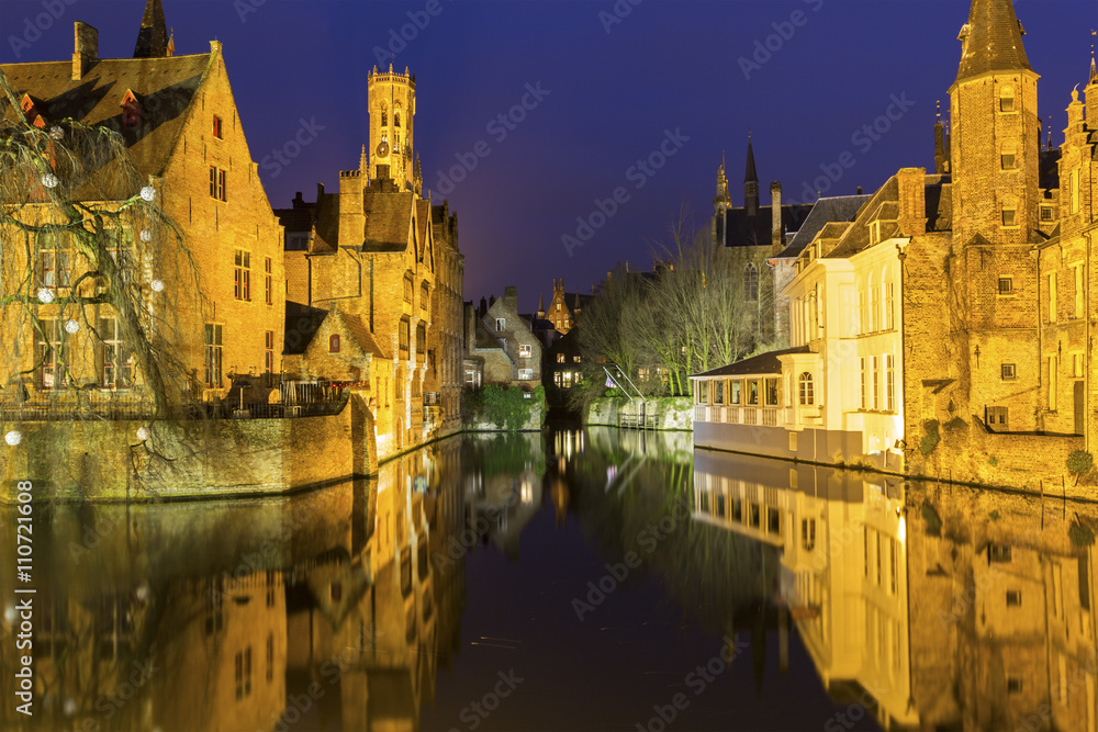 A canal in Bruges with the famous Belfry in Belgium