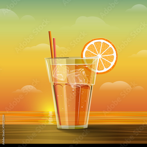 Glass with lemonade at sunset