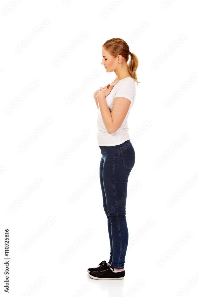 Side view of worried and sad young woman Side view of worried and sad young woman