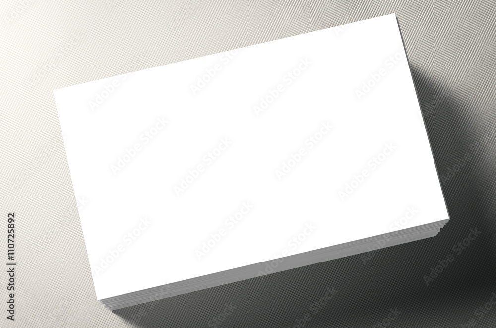 Fototapeta premium stack of white blank name card on grey background