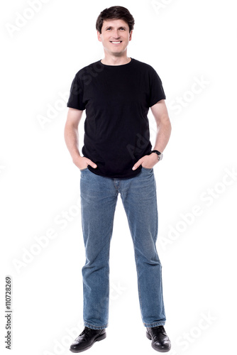 Casual man with hands in pockets.