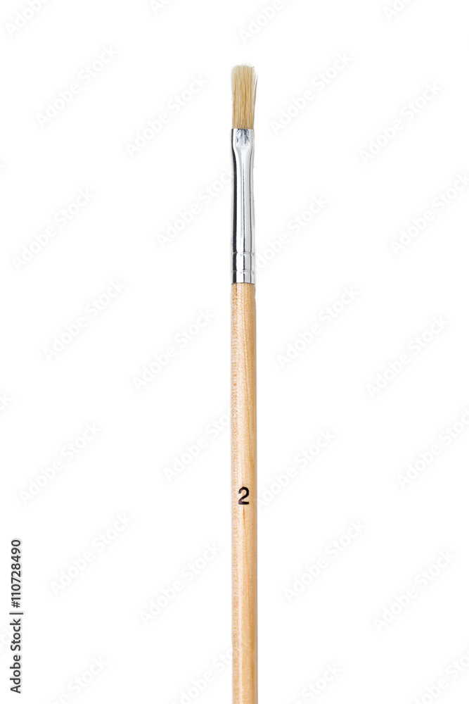 cropped view of a paintbrush over white background. cropped view of a paintbrush over white background.