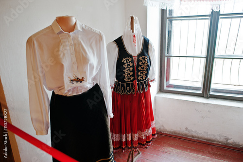 Elements of the old women's and men's traditional clothing at Palanok castle museum photo