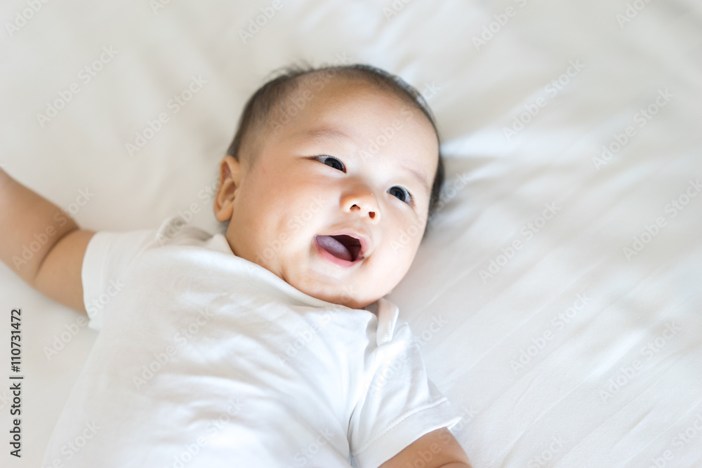 Portrait of a newborn Asian baby on the bed Portrait of a newborn Asian baby on the bed