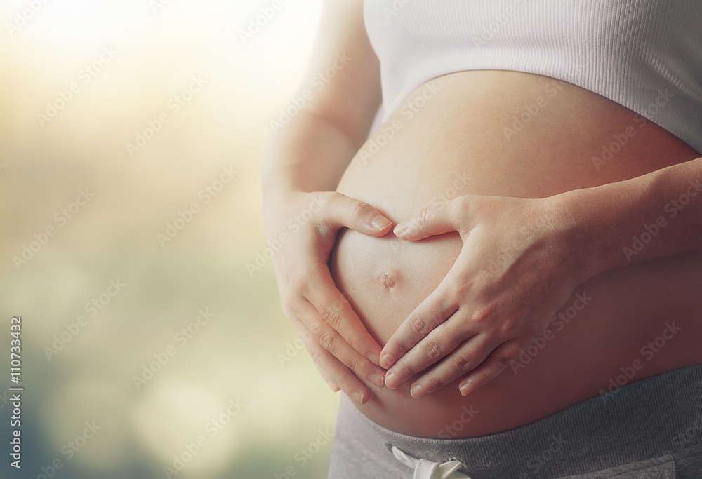 pregnant woman's belly - obrazy, fototapety, plakaty 