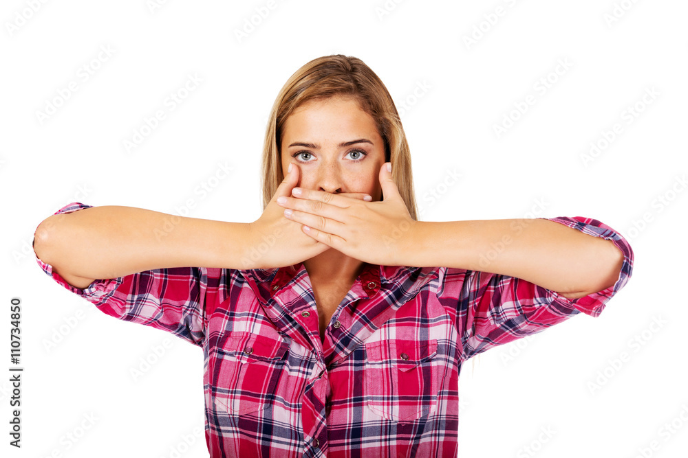 Young woman covering her mouth. Speak no evil concept Young woman covering her mouth. Speak no evil concept
