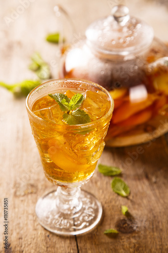 Tea with fruits and fresh mint photo