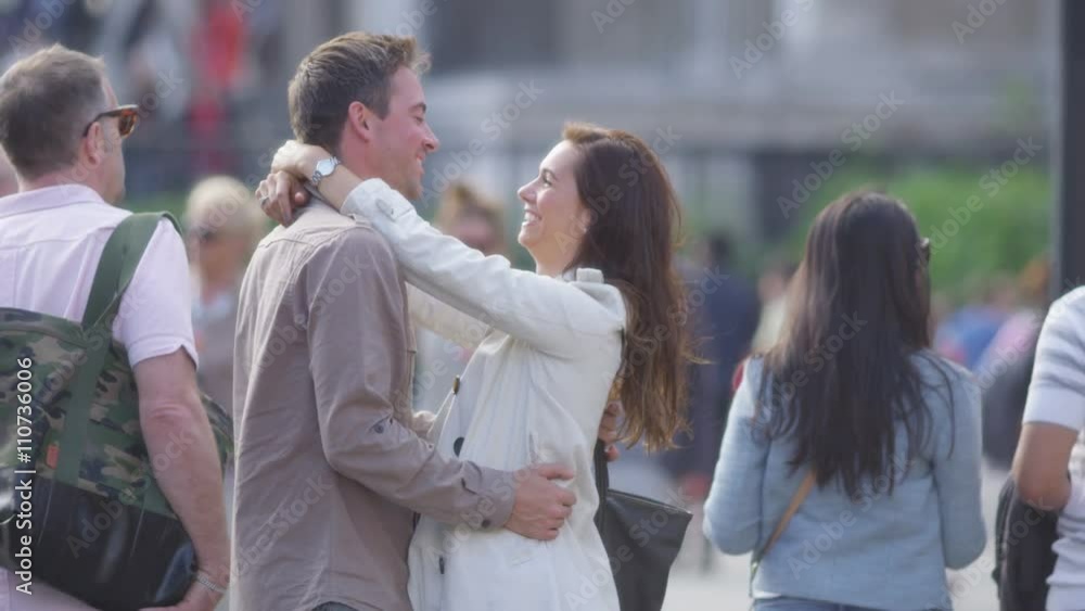 Attractive romantic couple embrace outdoors in the city Attractive romantic couple embrace outdoors in the city