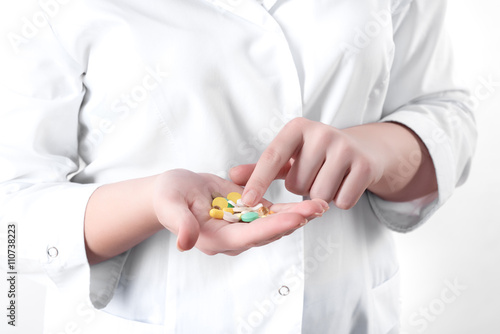 pills in the hand of a doctor.