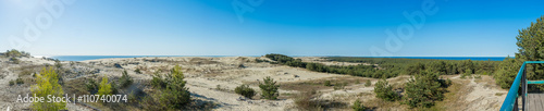 Panorama of sandy dunes and blue sky in the spring morning. Efa Height., Curonian Spit National Park, Russia.