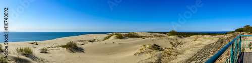 Panorama of sandy dunes and blue sky in the spring morning. Efa Height., Curonian Spit National Park, Russia.