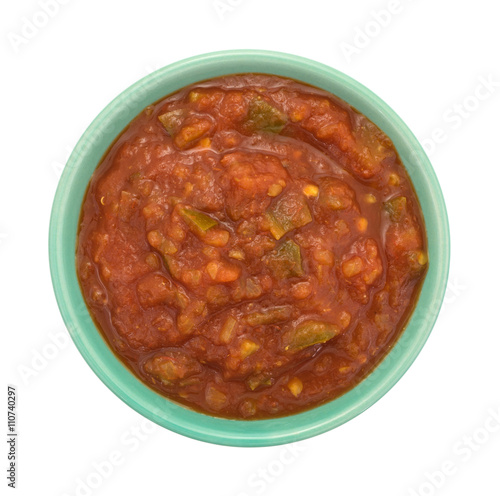 Bowl of chunky salsa sauce on a white background