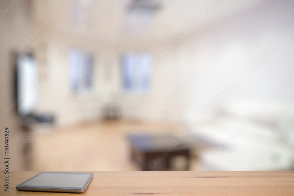 tablet on wooden table