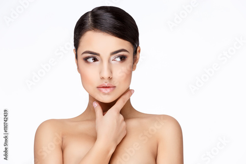 Young brunette woman with beautiful clean skin