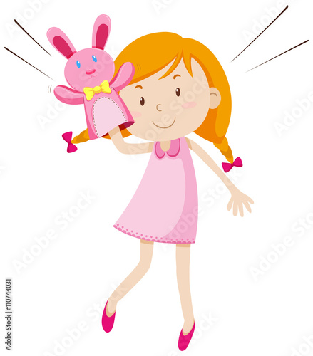Girl playing with rabbit puppet