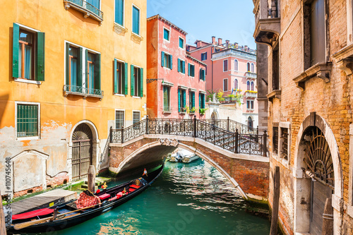 Scenic canal with bridge and colorful buildings in Venice, Italy © smallredgirl