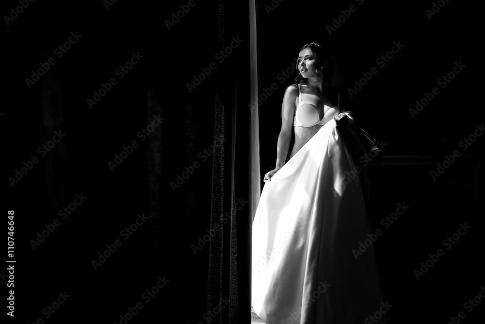 Black and white photo of the bride in the underwear