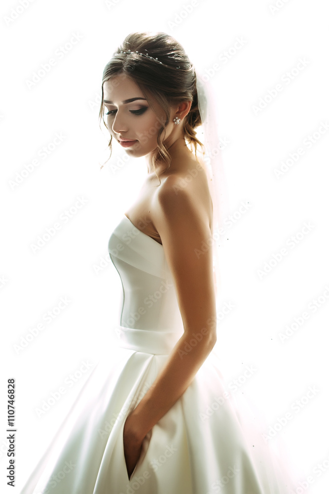 Emotional portrait of the bride in the gorgeous gown Emotional portrait of the bride in the gorgeous gown
