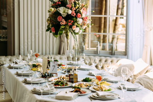 Table with food and flowers on the wedding