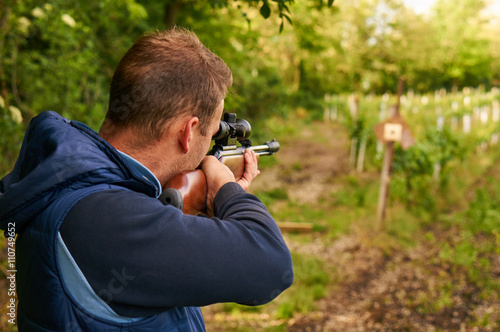 Man shoot with air rifle.