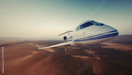 Realistic Photo of White Luxury Generic Design Private Jet Flying in Sky under Earth Surface.Uninhabited Desert Mountains Background. Business Travel Picture.Wide.Front view.Film Effect.3D rendering. © SFIO CRACHO