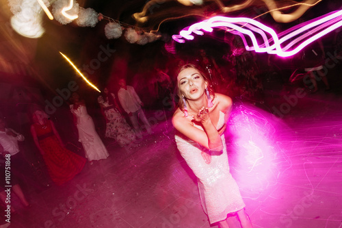 Bride sends air kiss on the dance floor