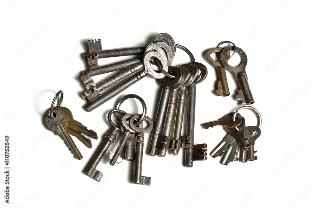 many old keys on keyrings on white Background many old keys on keyrings on white Background