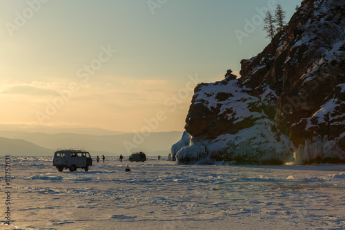 Group of tourists on the ice near island Lohmaty.