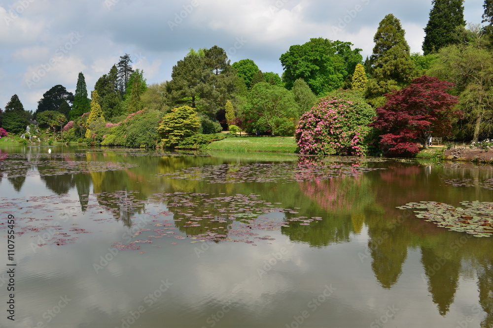 An English country garden with a lake in late springtime.
