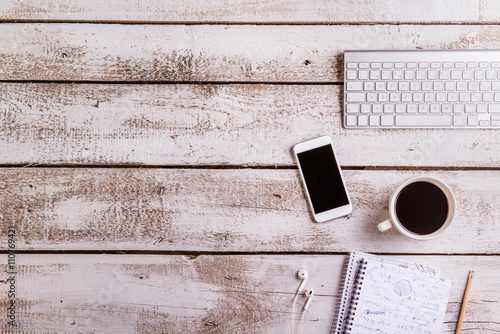 Desk, gadgets and office supplies. Flat lay. Copy space.