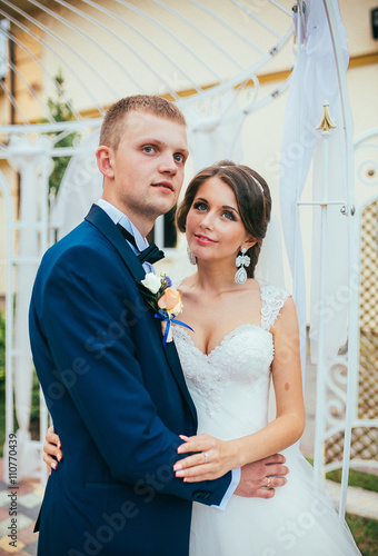Sensual romantic newlywed couple, hugging, face closeup