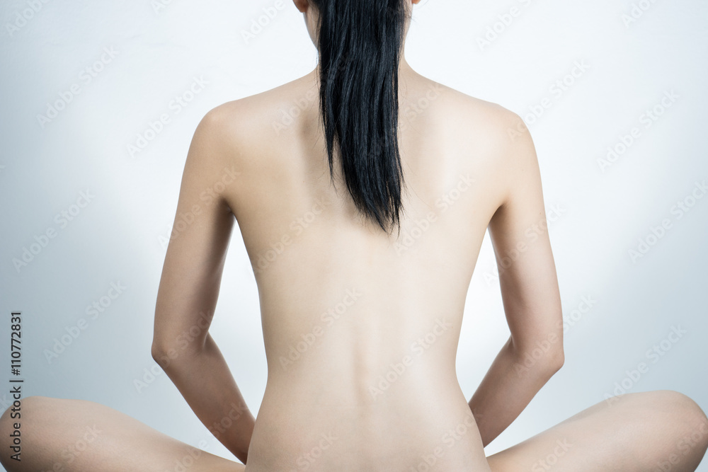 Woman meditating in a peaceful setting Woman meditating in a peaceful setting