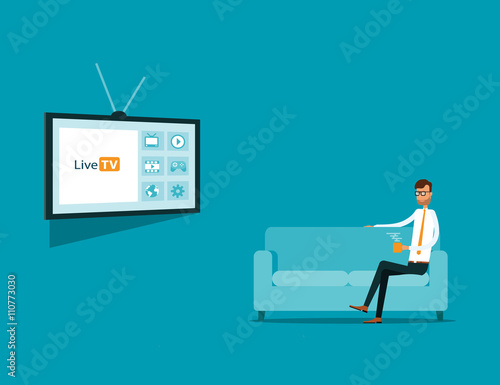 businessman watching online TV  on sofa