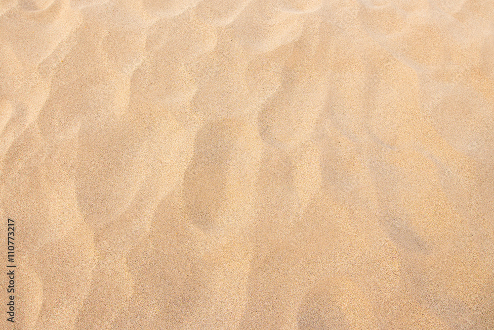 closeup sand texture pattern background of a beach in the summer