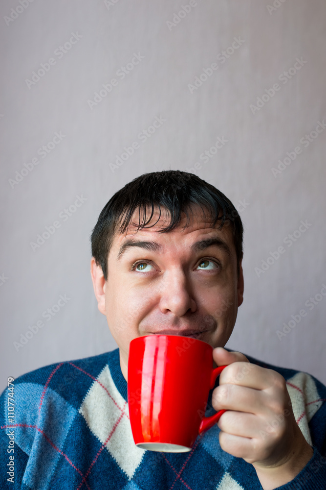 man drinking coffee with red cup man drinking coffee with red cup