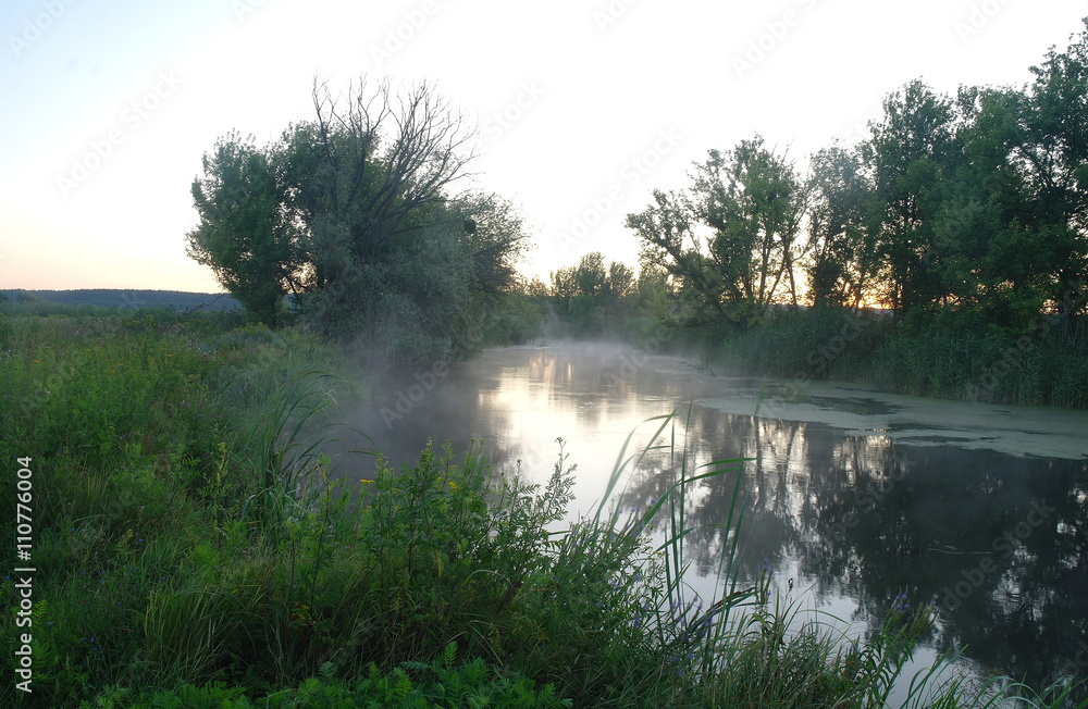 Morning landscape with fog on the river