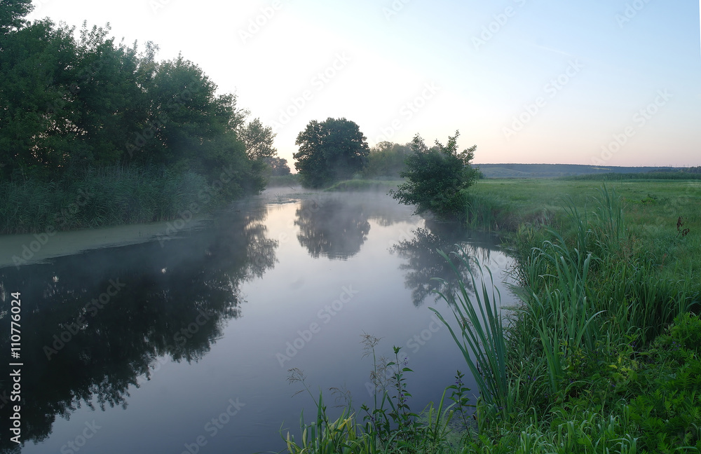 Morning landscape with fog on the river