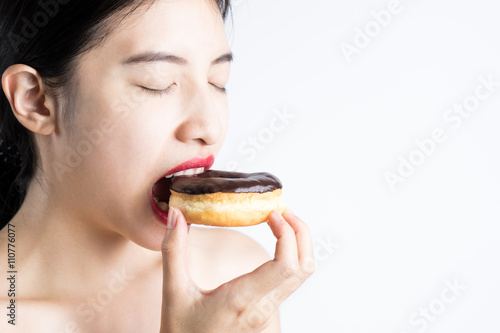 Asian Woman eating donut on white background