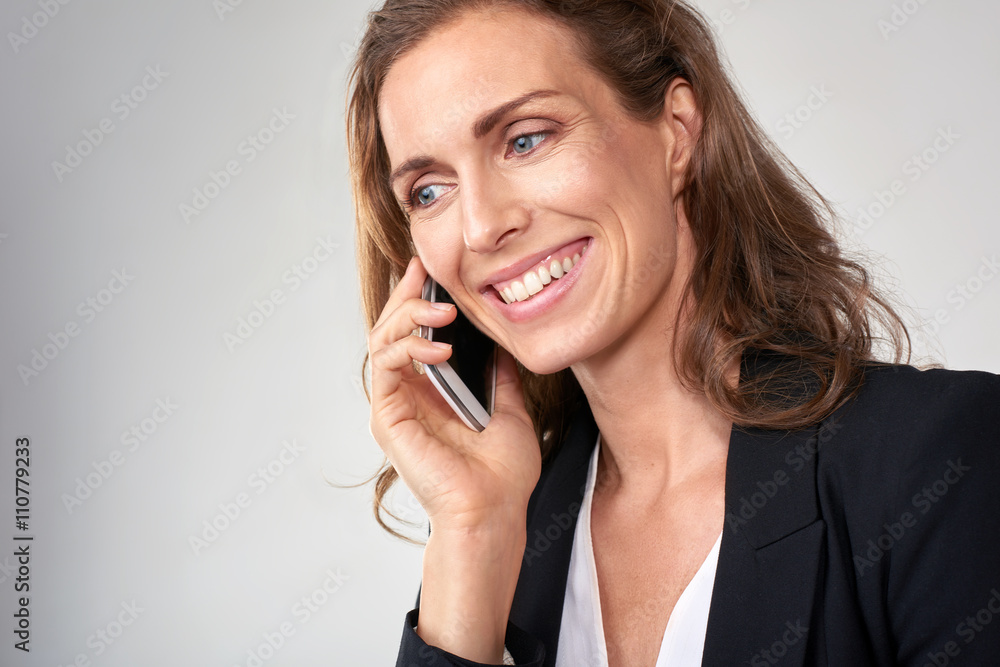 Caucasian business woman talking on the phone Caucasian business woman talking on the phone