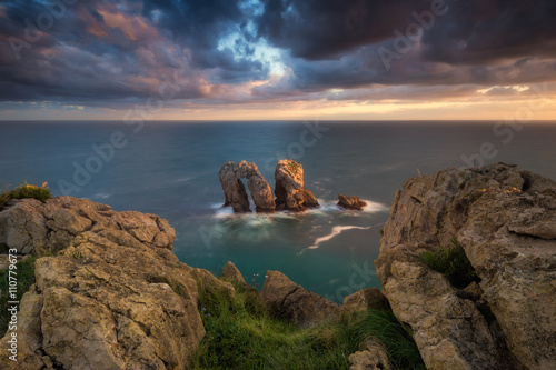 Sunrise at the coast, ocean and rocks in Cantabria, Spain