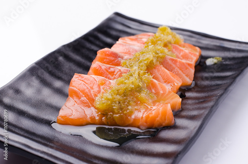 Slices of Salmon Served with Spicy Sauce