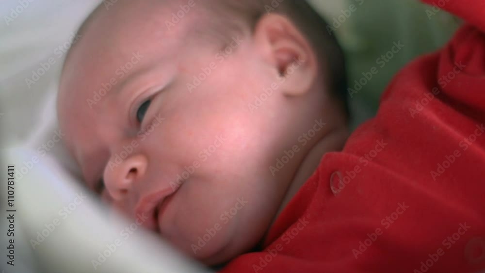 Beautiful infant baby girl in bed
