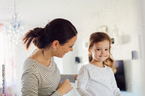 Mother enjoying time with her daughter at home