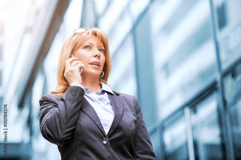 Businesswoman on the phone outdoors Businesswoman on the phone outdoors