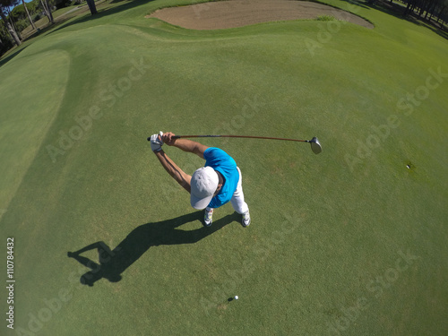 top view of golf player hitting shot photo