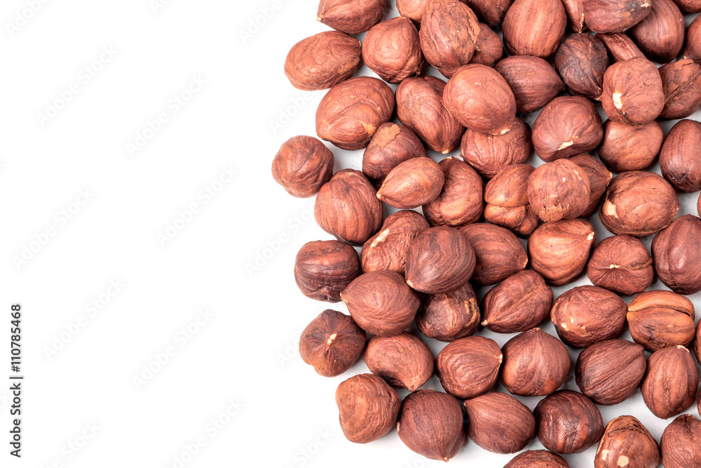 peeled hazelnuts isolated on white background macro